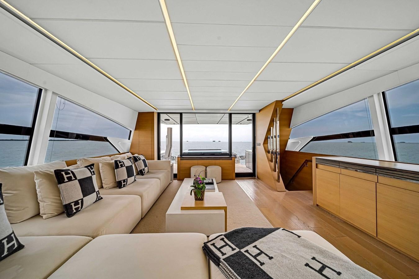a room with a couch and a table aboard ARENA Yacht for Sale