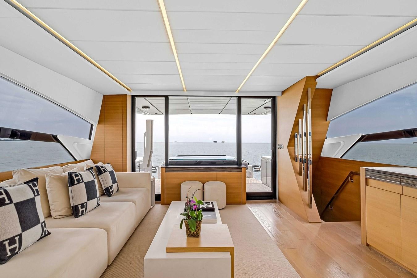 a modern looking living room aboard ARENA Yacht for Sale