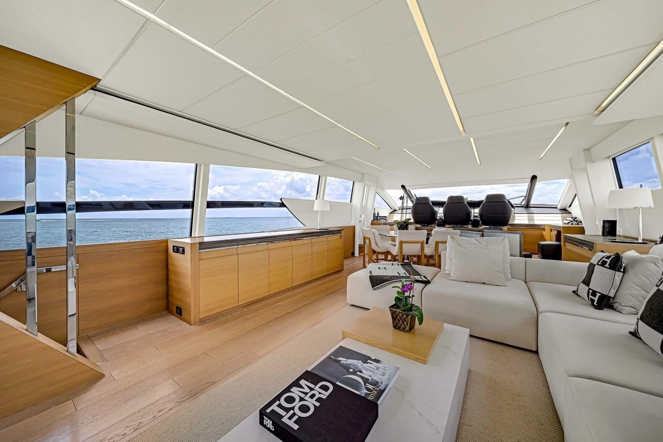 a living room with a large window aboard ARENA Yacht for Sale