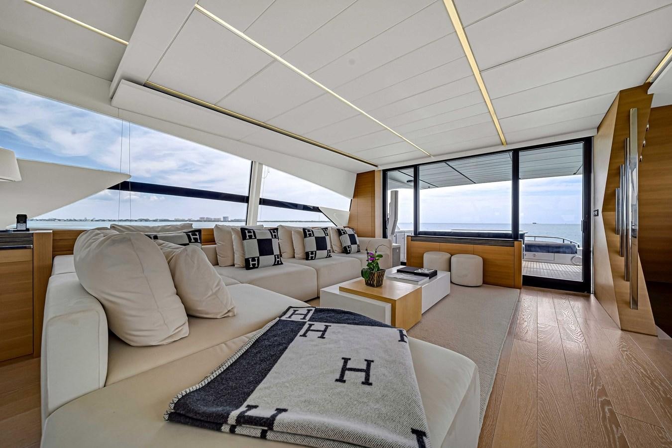 a room with a bed and a table aboard ARENA Yacht for Sale