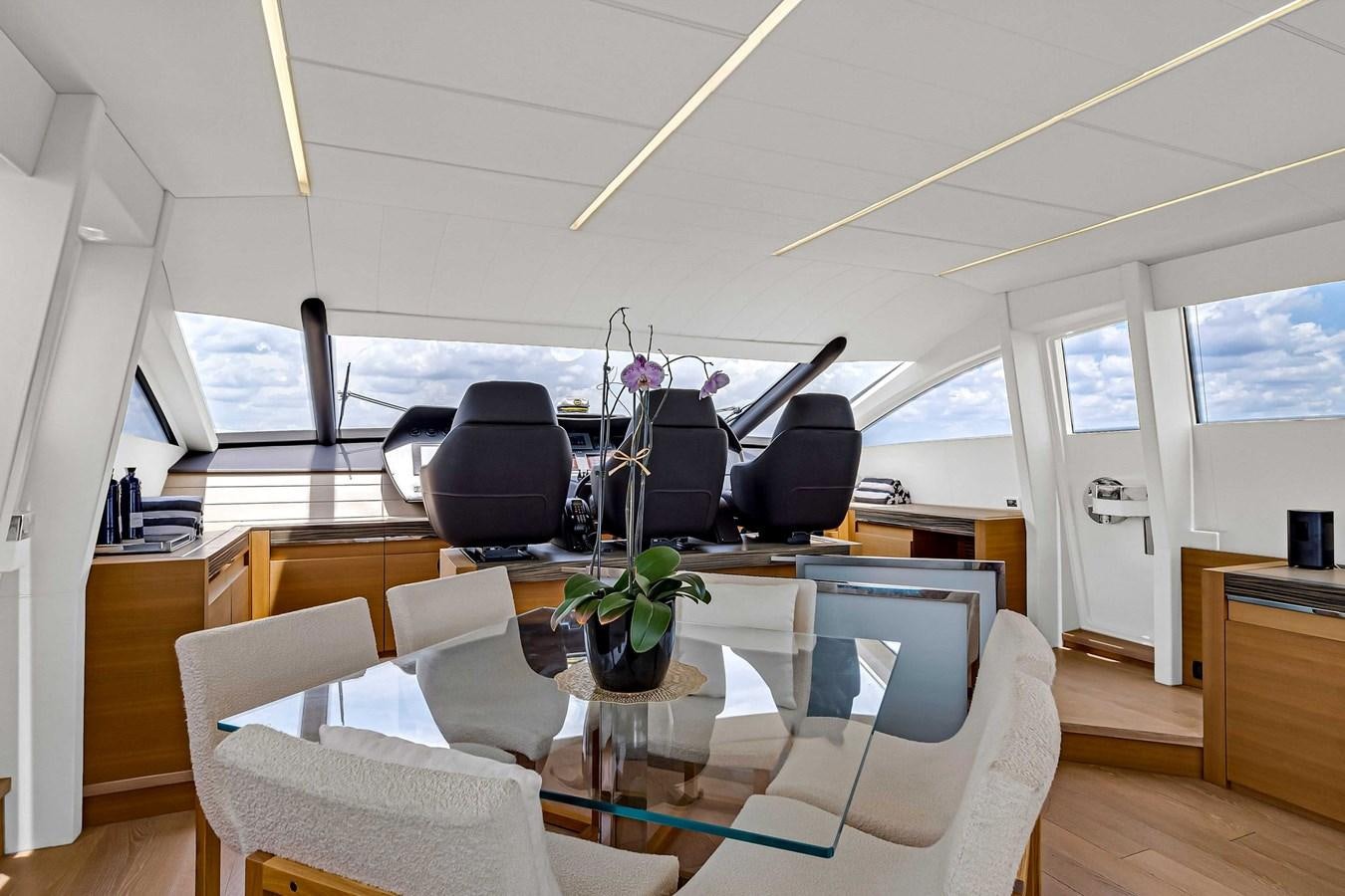 a room with a table and chairs aboard ARENA Yacht for Sale