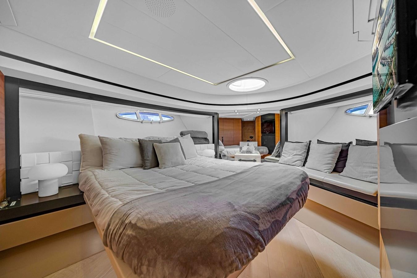 a room with a bed and a chair aboard ARENA Yacht for Sale