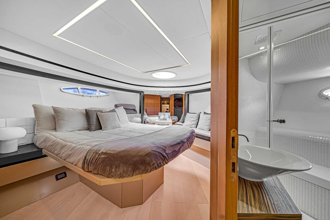 a large bedroom with a glass door aboard ARENA Yacht for Sale