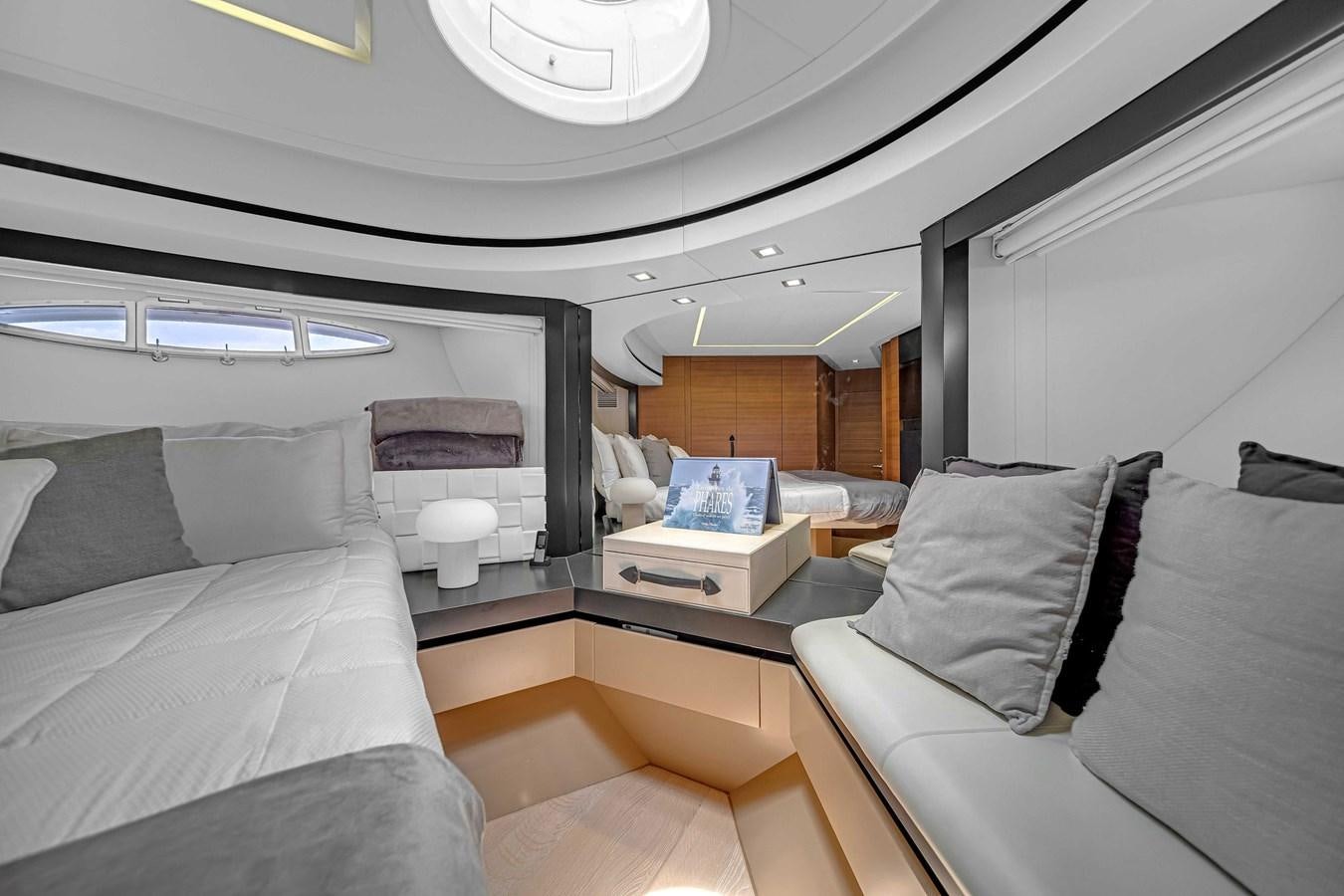 a room with a couch and a table aboard ARENA Yacht for Sale