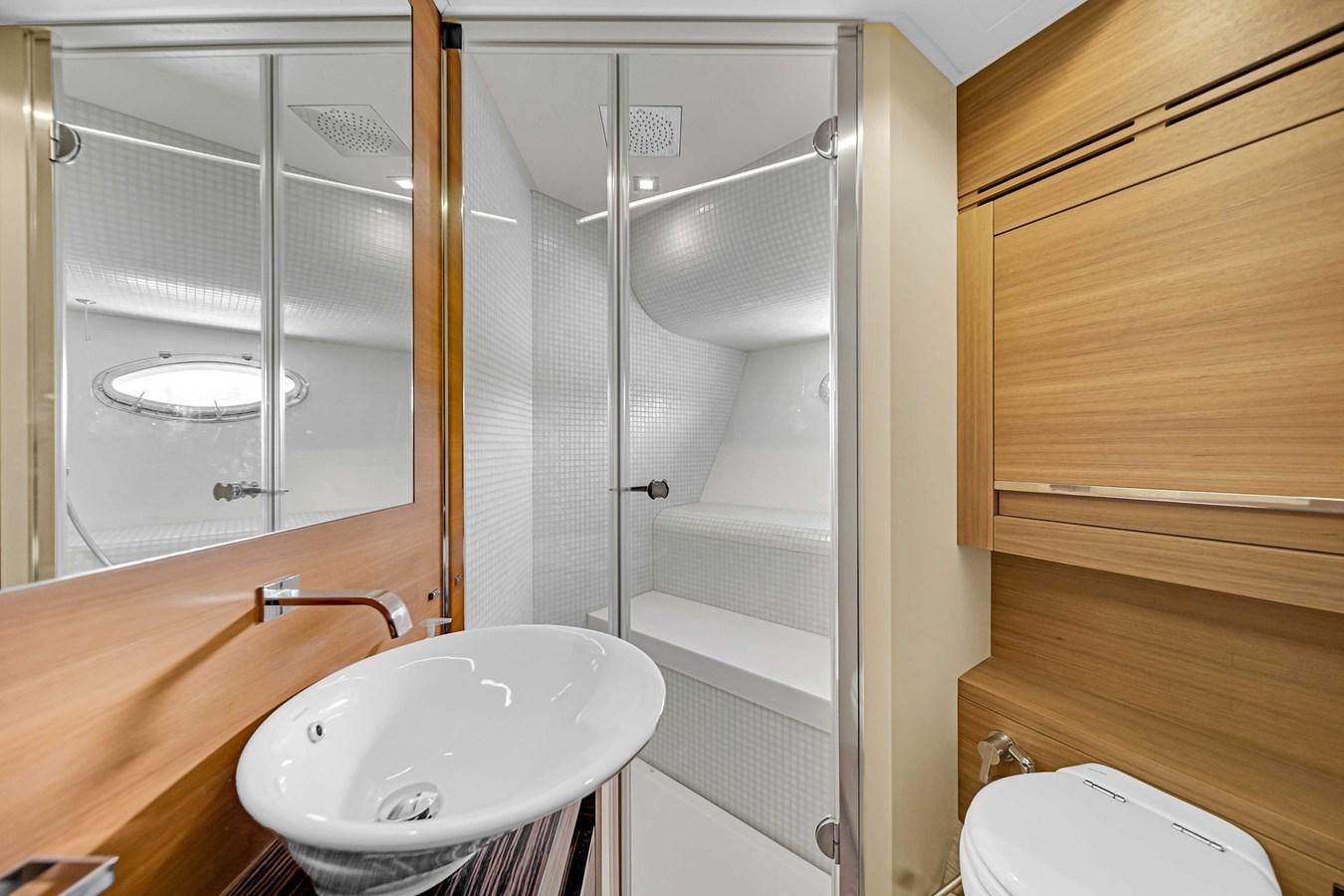 a bathroom with a sink and a shower aboard ARENA Yacht for Sale