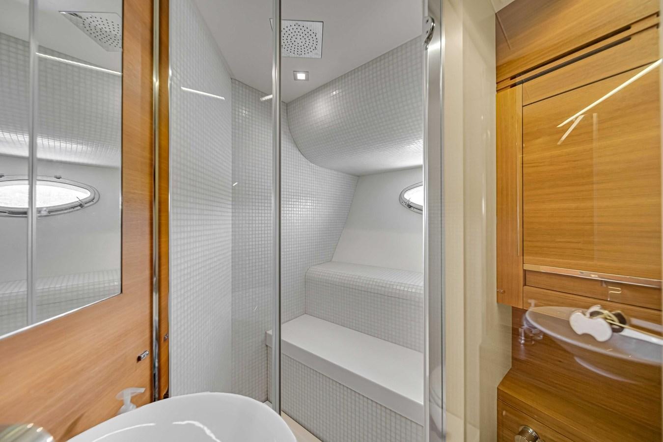 a bathroom with a shower and sink aboard ARENA Yacht for Sale