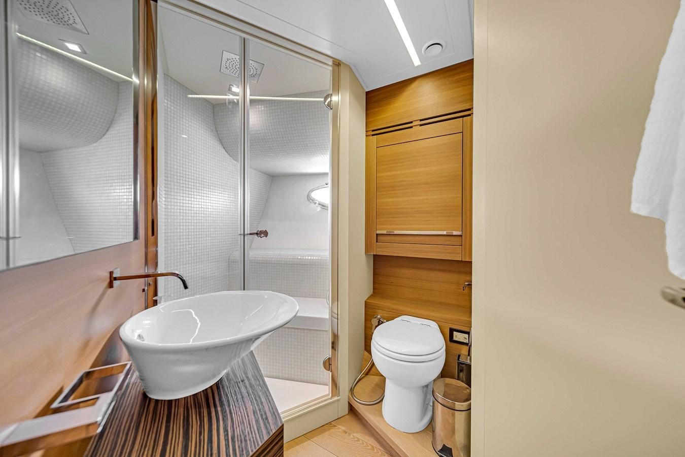 a bathroom with a shower and toilet aboard ARENA Yacht for Sale