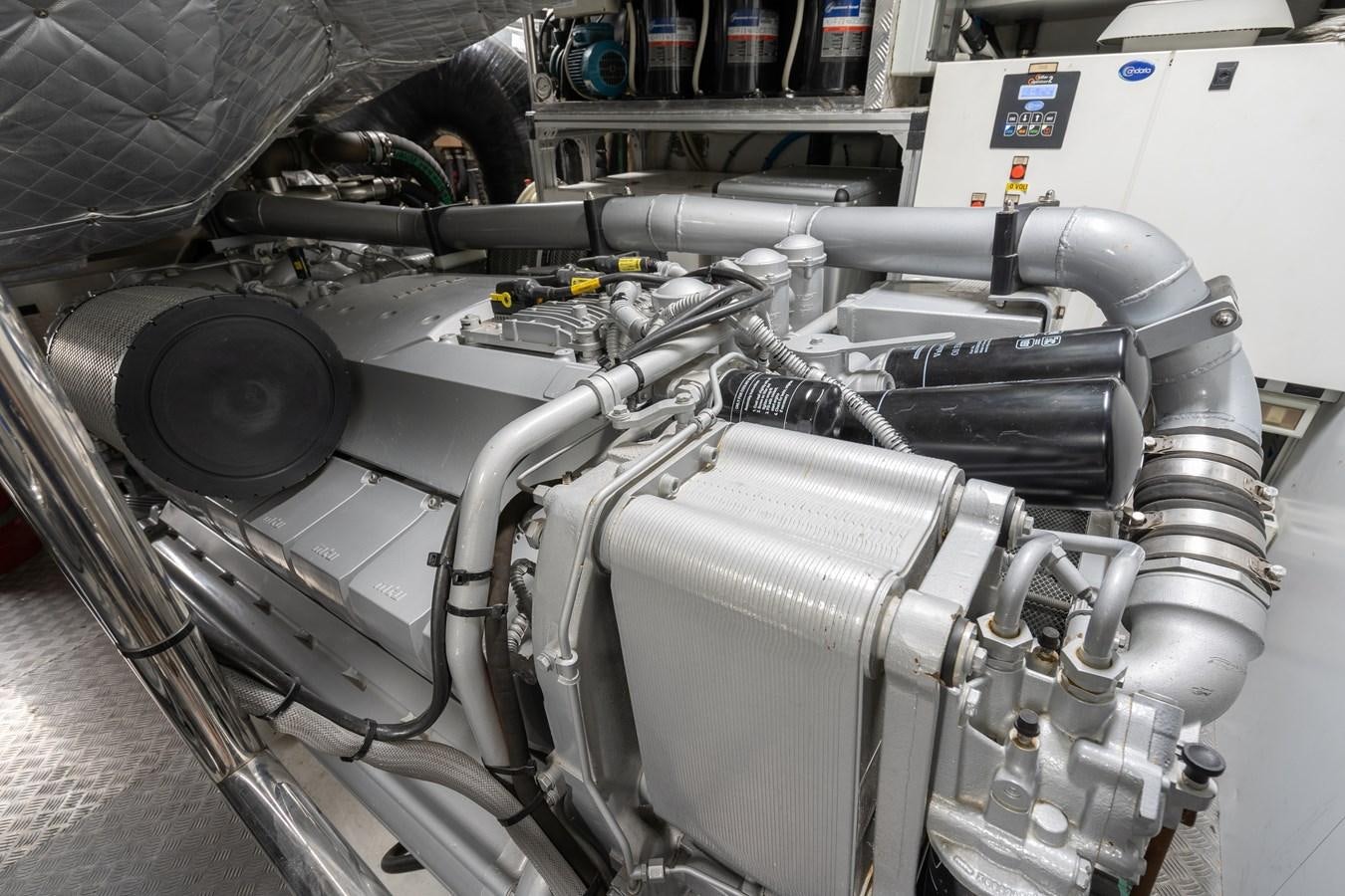 a close-up of a car engine aboard ARENA Yacht for Sale