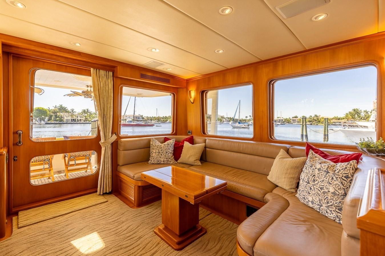 a living room with a couch and a table aboard SUNSHINE Yacht for Sale