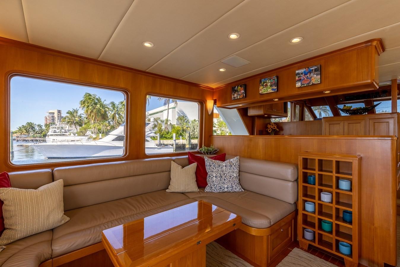 a living room with a couch and a table aboard SUNSHINE Yacht for Sale