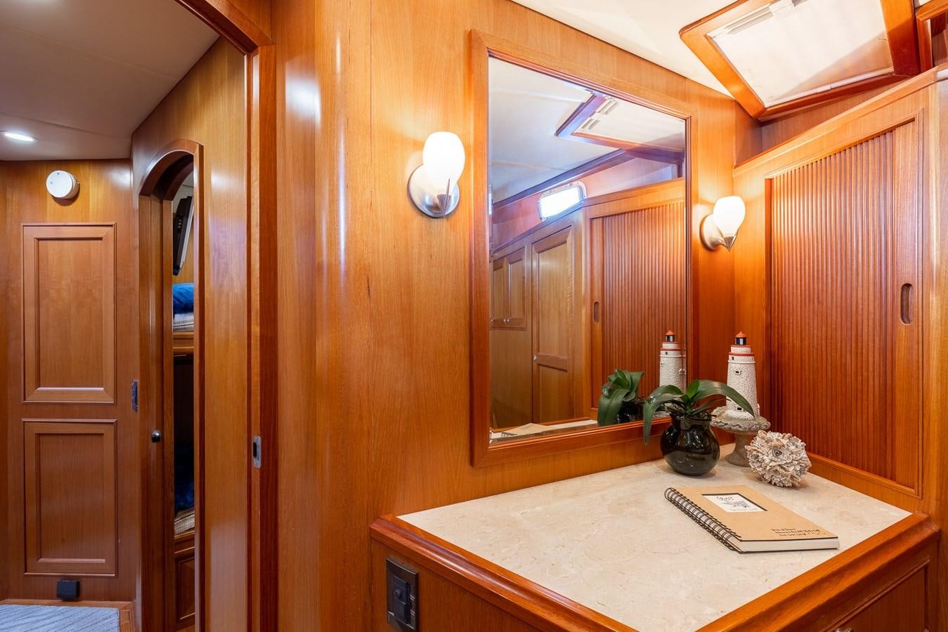 a bathroom with a countertop sink and mirror aboard SUNSHINE Yacht for Sale