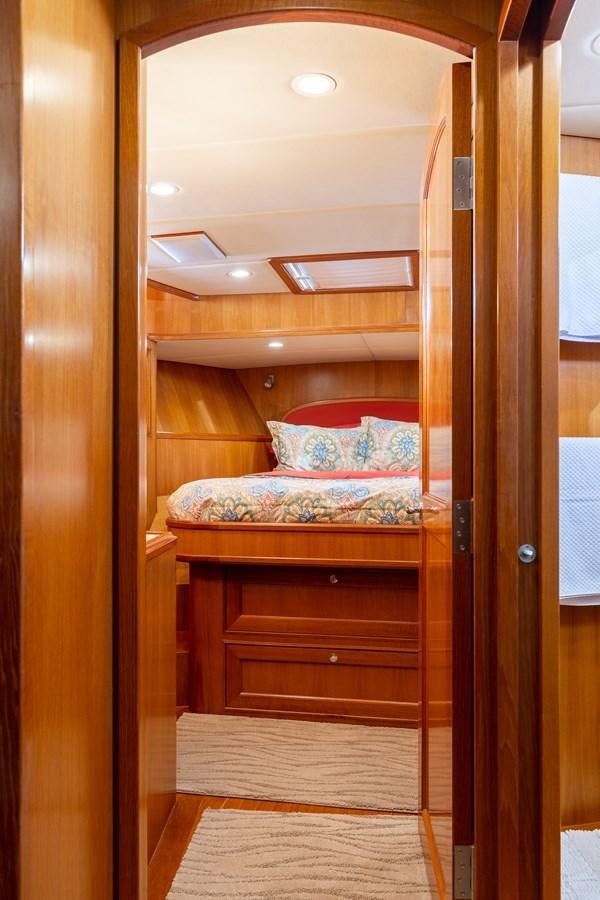 a wooden bunk bed aboard SUNSHINE Yacht for Sale