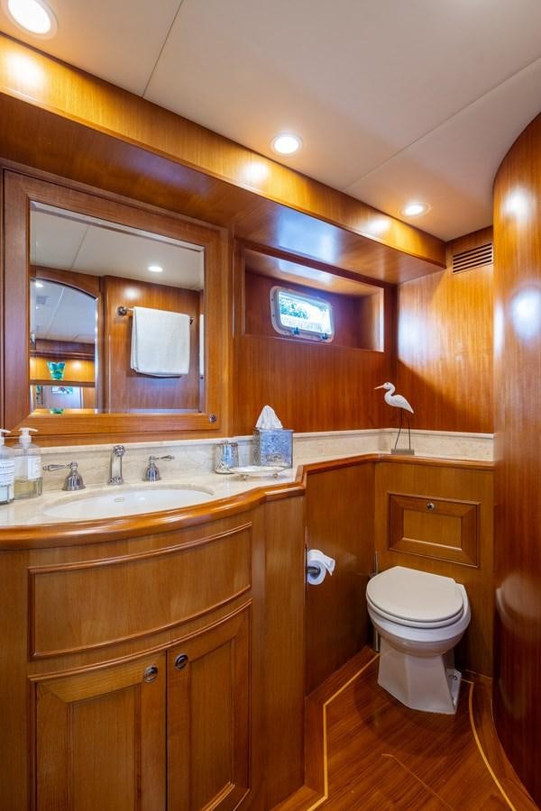a bathroom with a toilet and a sink aboard SUNSHINE Yacht for Sale