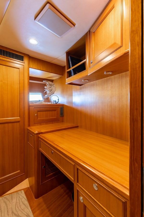 a kitchen with wooden cabinets aboard SUNSHINE Yacht for Sale