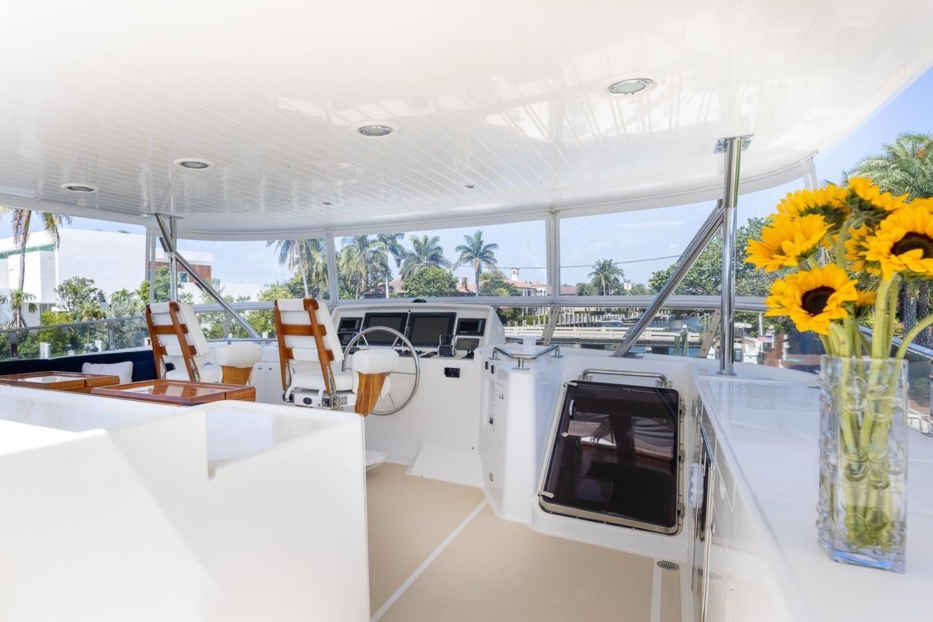 a room with a table and chairs aboard SUNSHINE Yacht for Sale