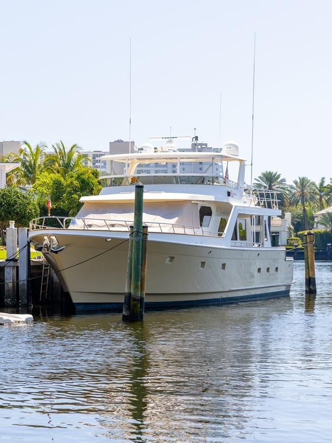 a boat docked at a pier aboard SUNSHINE Yacht for Sale