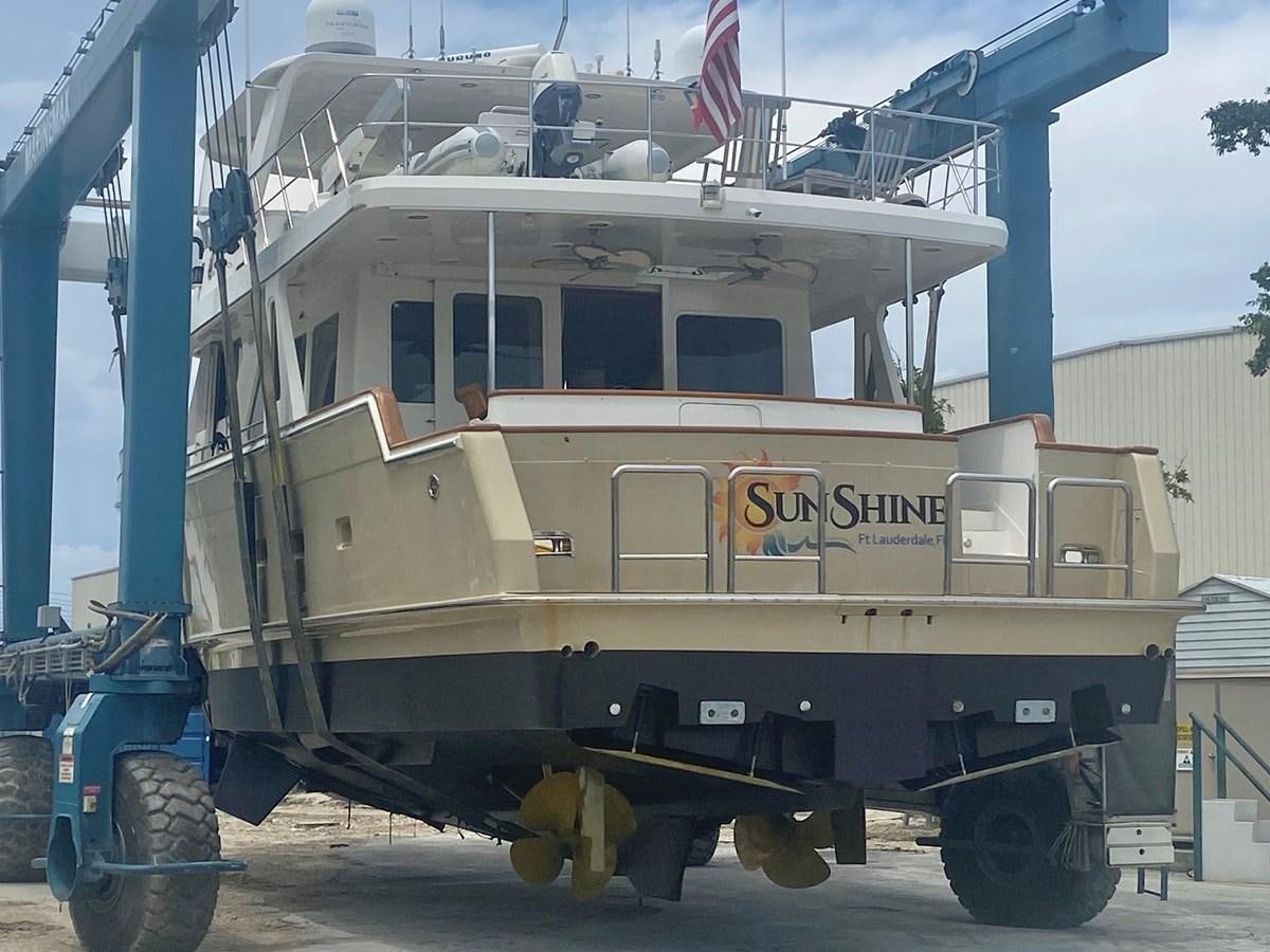a large white boat aboard SUNSHINE Yacht for Sale