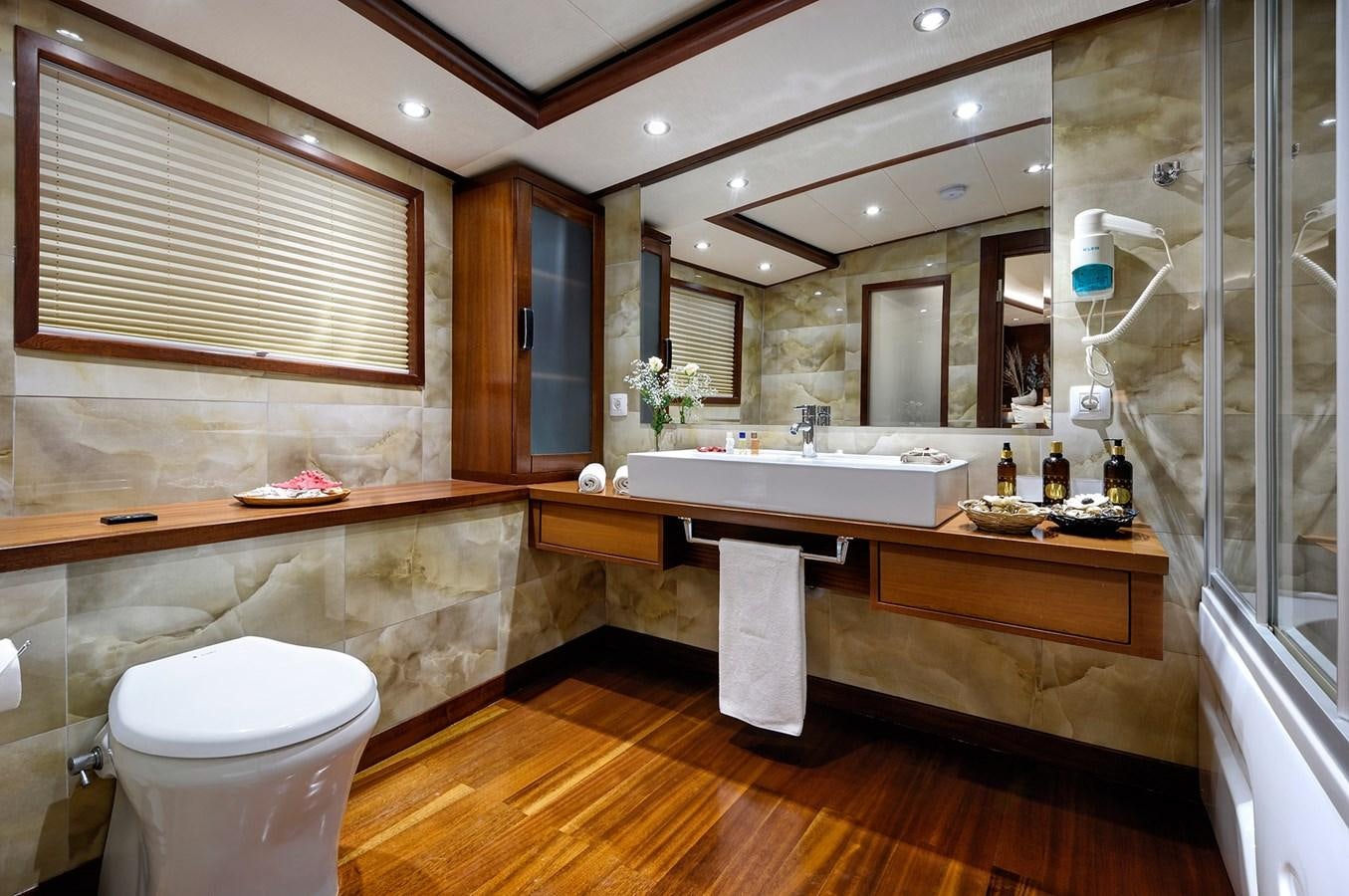 a bathroom with a sink toilet and a bathtub aboard ALESSANDRO I Yacht for Sale
