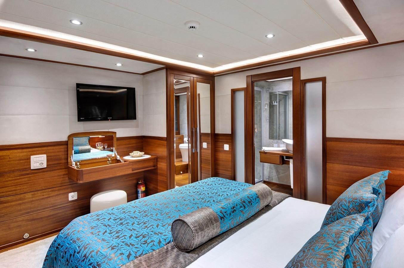 a bedroom with a bed and a tv aboard ALESSANDRO I Yacht for Sale