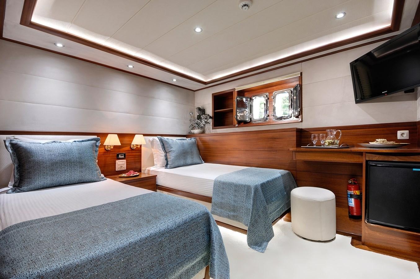 a room with two beds aboard ALESSANDRO I Yacht for Sale