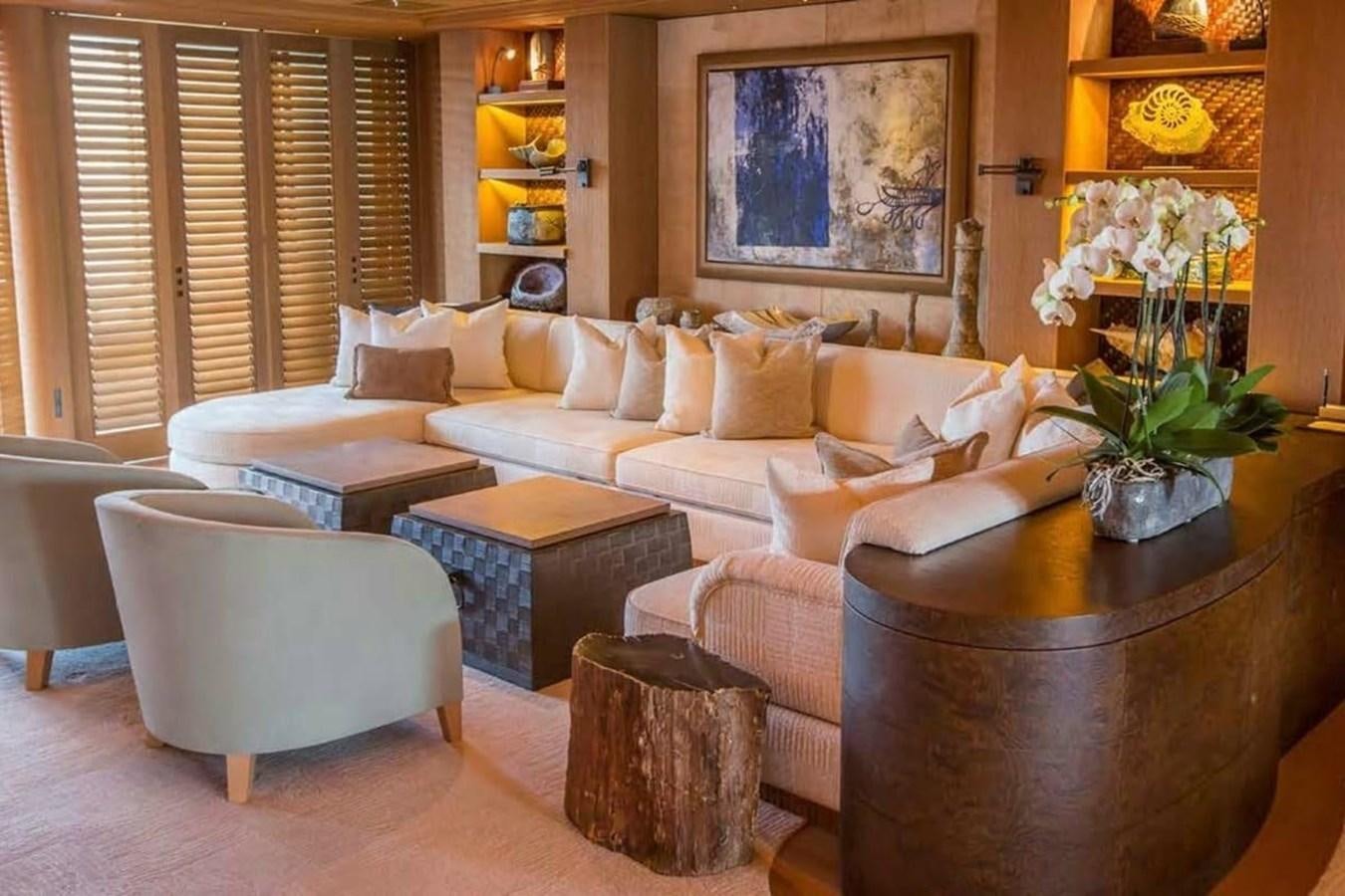 a living room with a couch and a table aboard PELORUS Yacht for Sale