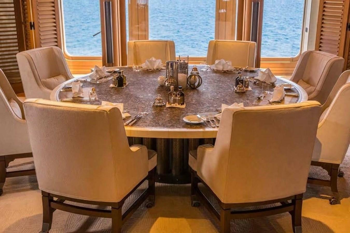 a dining table set for a dinner aboard PELORUS Yacht for Sale