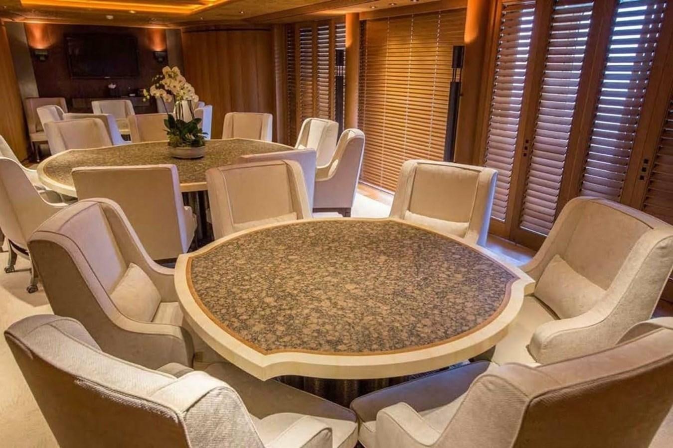 a room with a table and chairs aboard PELORUS Yacht for Sale