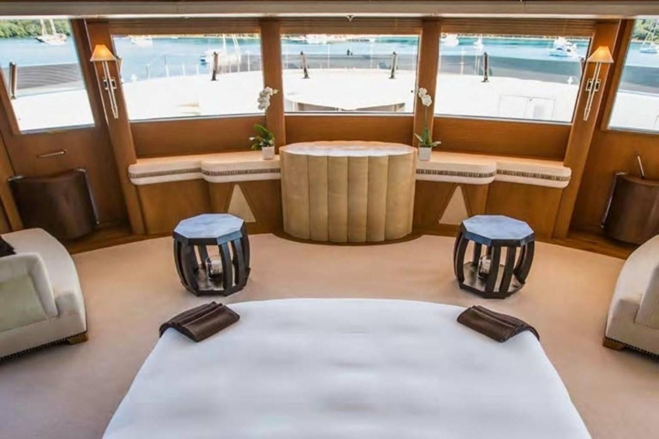 a room with a table and chairs aboard PELORUS Yacht for Sale