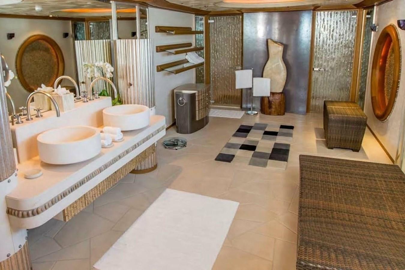 a bathroom with sinks and mirrors aboard PELORUS Yacht for Sale