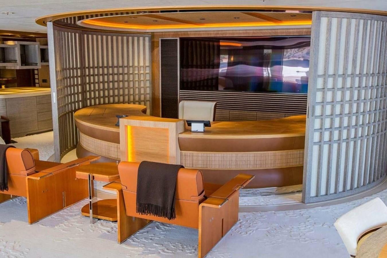 a room with chairs and a table aboard PELORUS Yacht for Sale