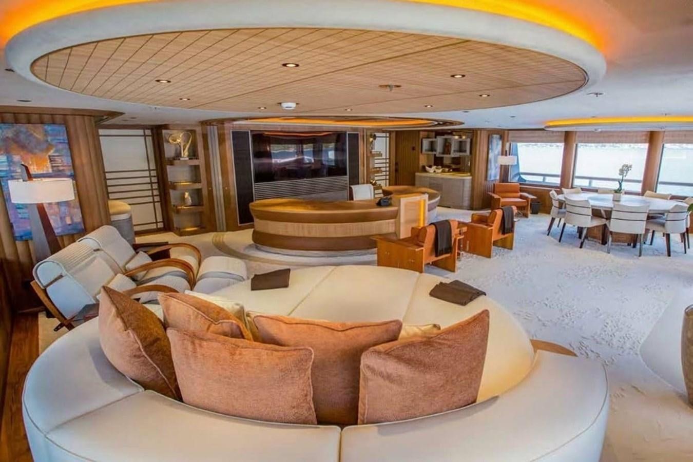 a living room with couches and tables aboard PELORUS Yacht for Sale