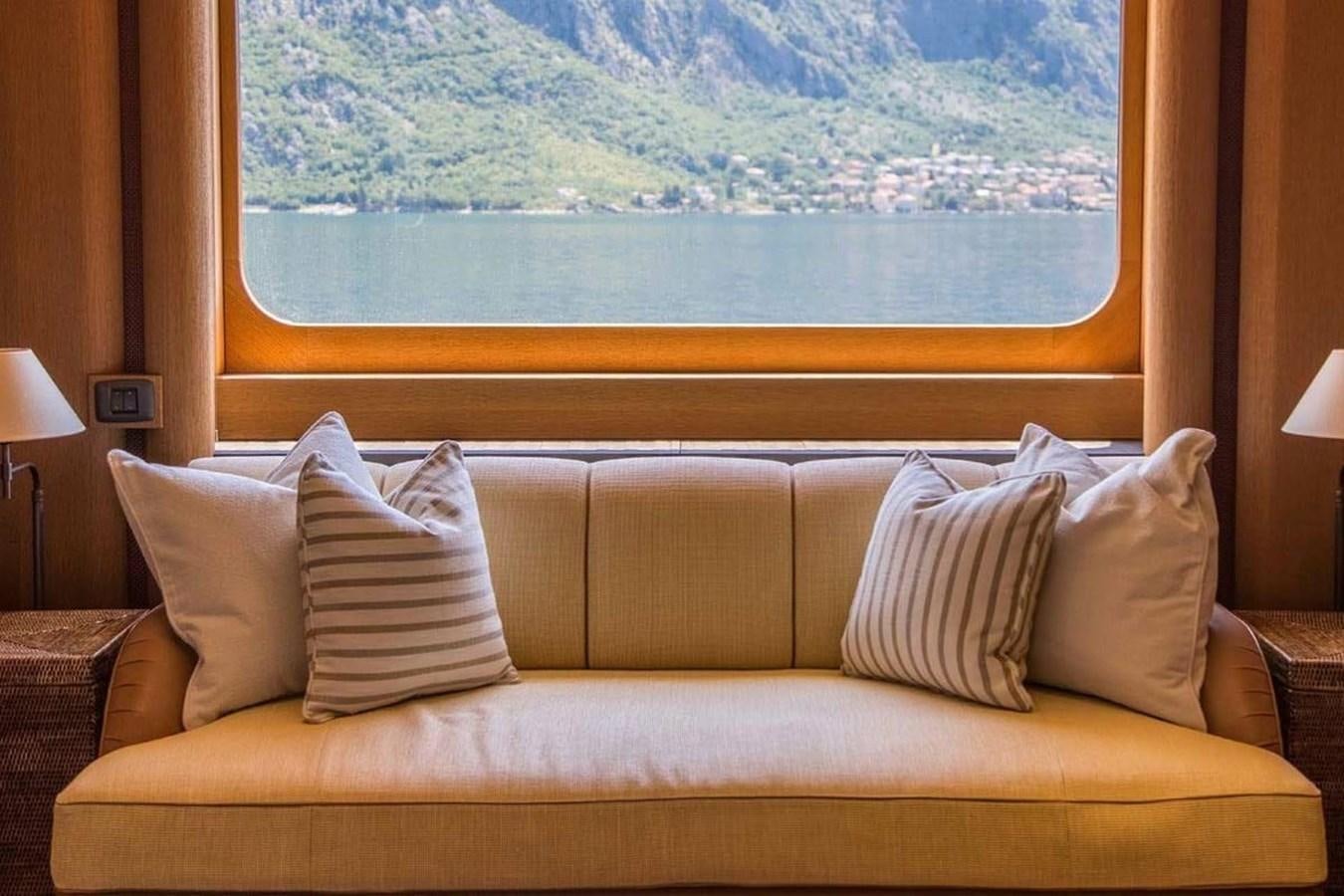 a couch with pillows aboard PELORUS Yacht for Sale