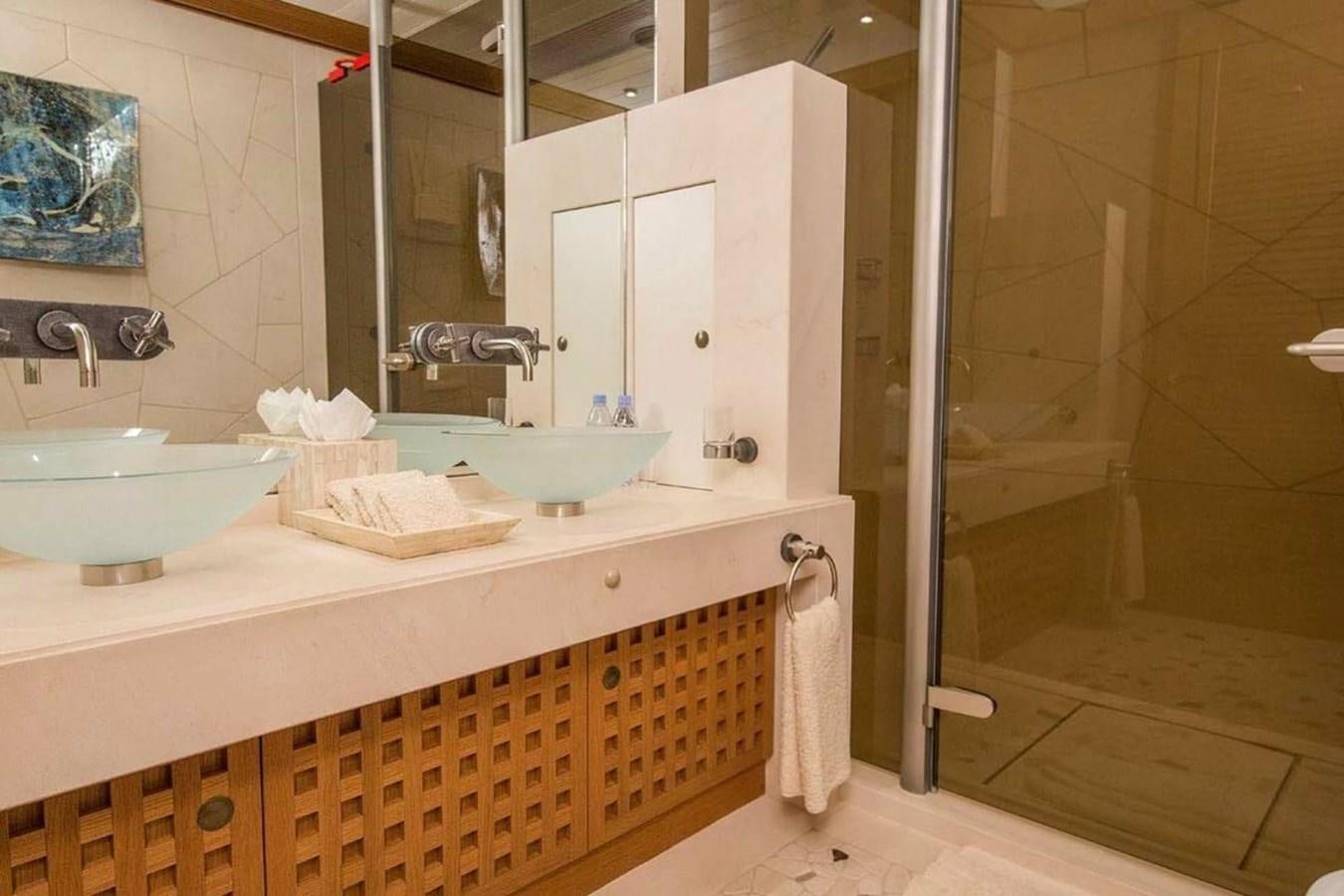 a bathroom with a sink and a shower aboard PELORUS Yacht for Sale
