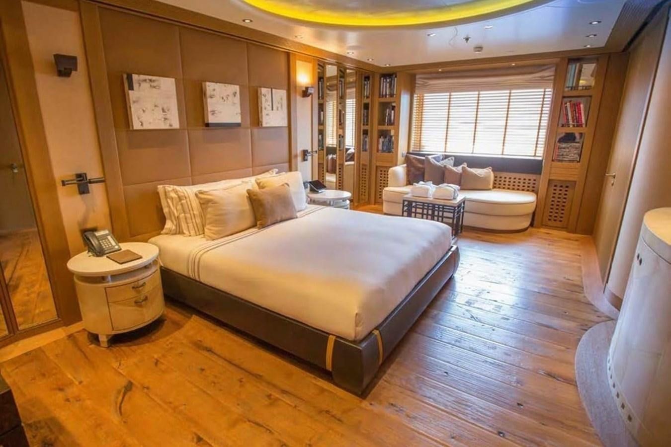 a large bedroom with a large bed aboard PELORUS Yacht for Sale