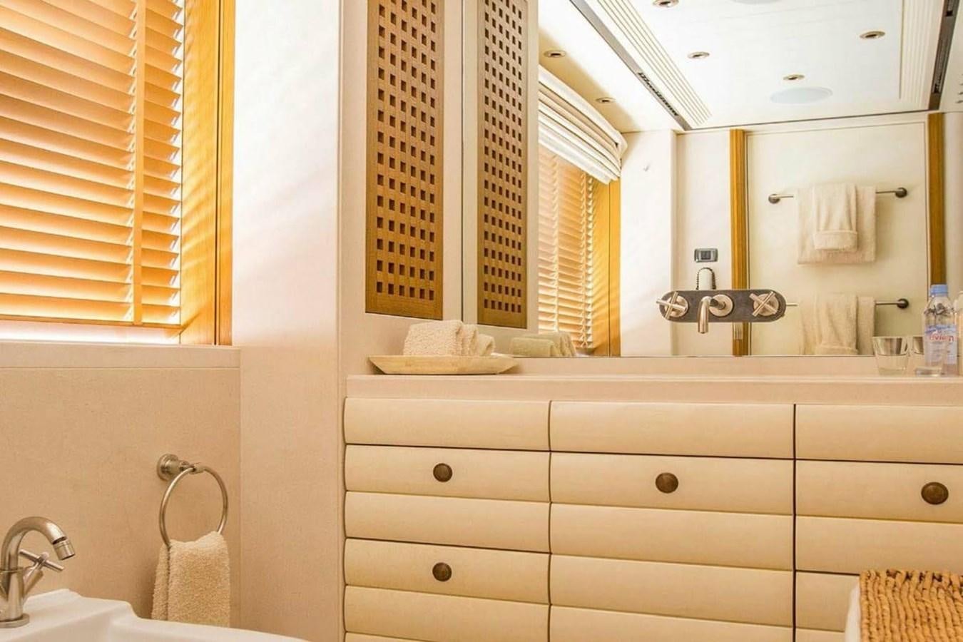 a bathroom with a mirror and a sink aboard PELORUS Yacht for Sale