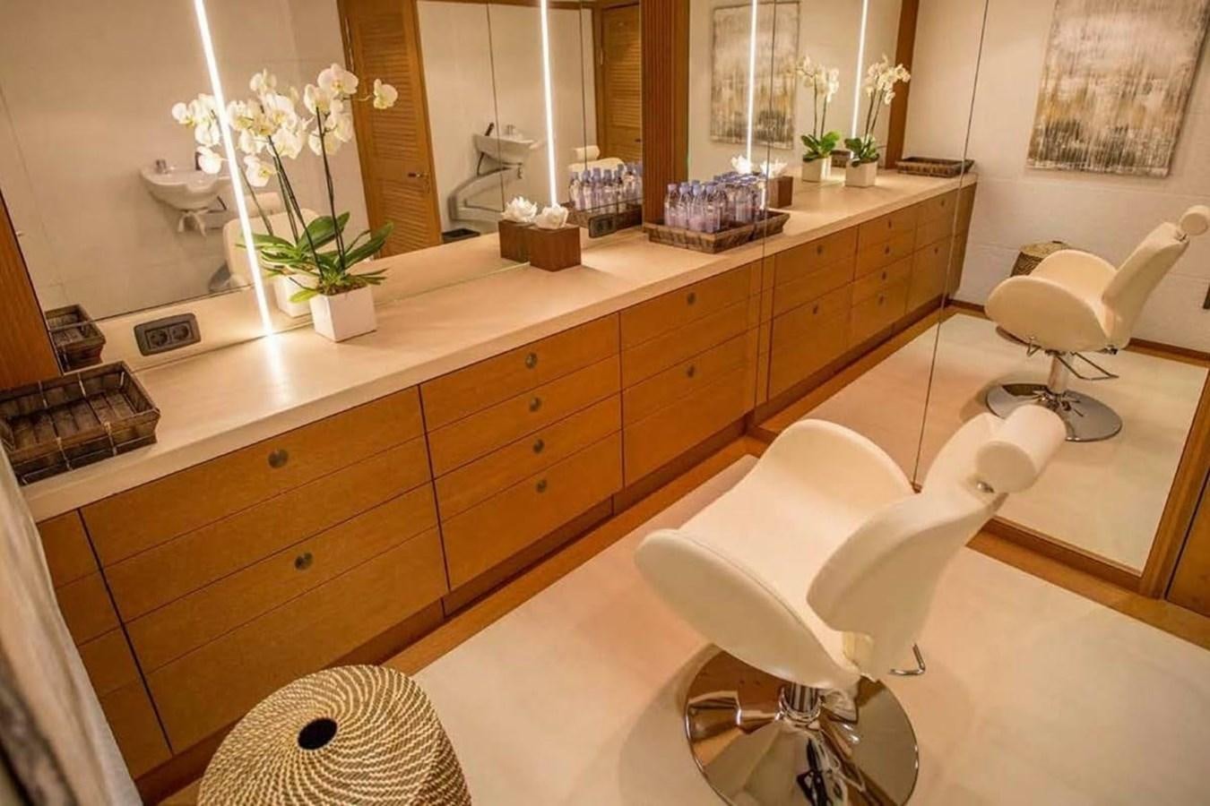 a bathroom with a countertop sink and a mirror aboard PELORUS Yacht for Sale