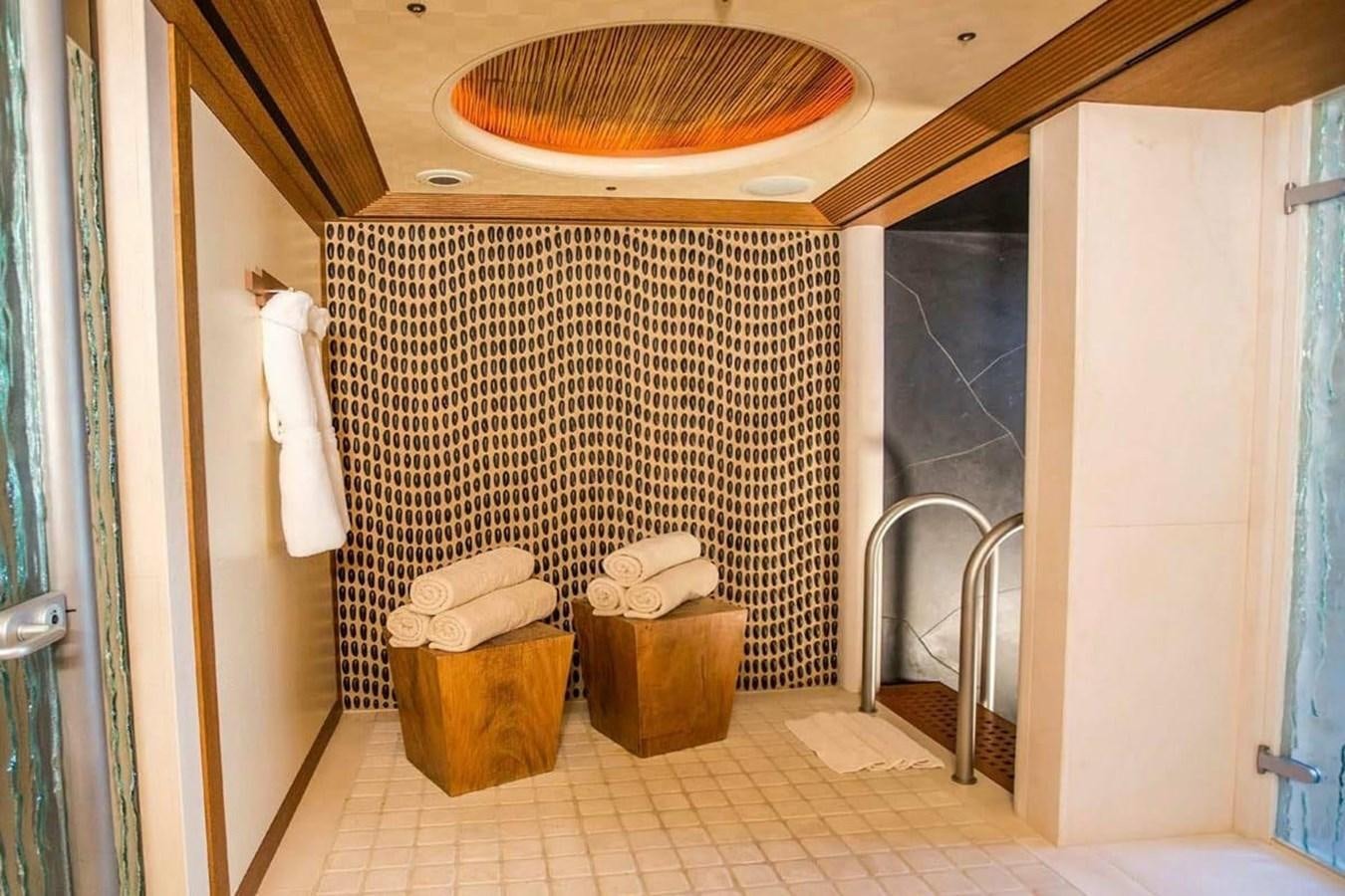 a bathroom with a shower curtain aboard PELORUS Yacht for Sale