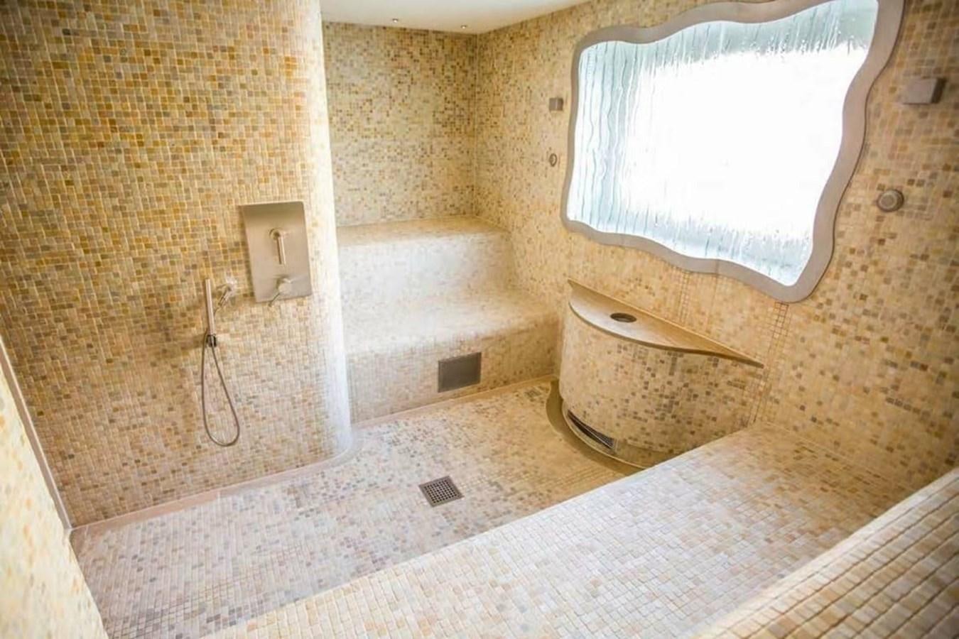 a bathroom with a tub and toilet aboard PELORUS Yacht for Sale
