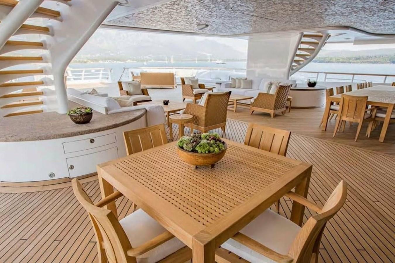 a room with a table and chairs aboard PELORUS Yacht for Sale