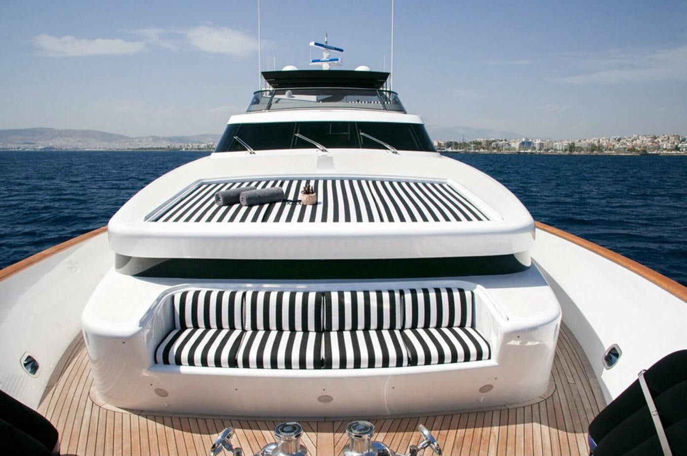 a white yacht on a deck aboard REGINA K Yacht for Sale