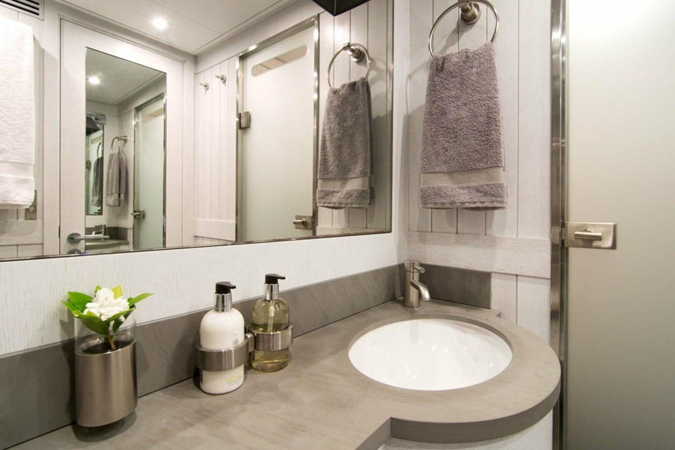 a bathroom with a sink and a mirror aboard REGINA K Yacht for Sale