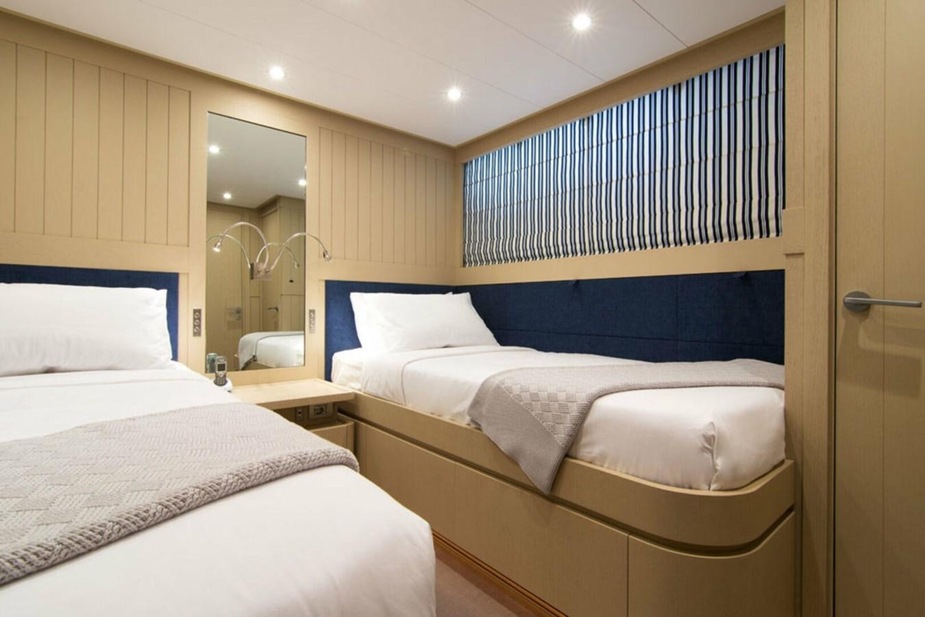 a room with two beds aboard REGINA K Yacht for Sale