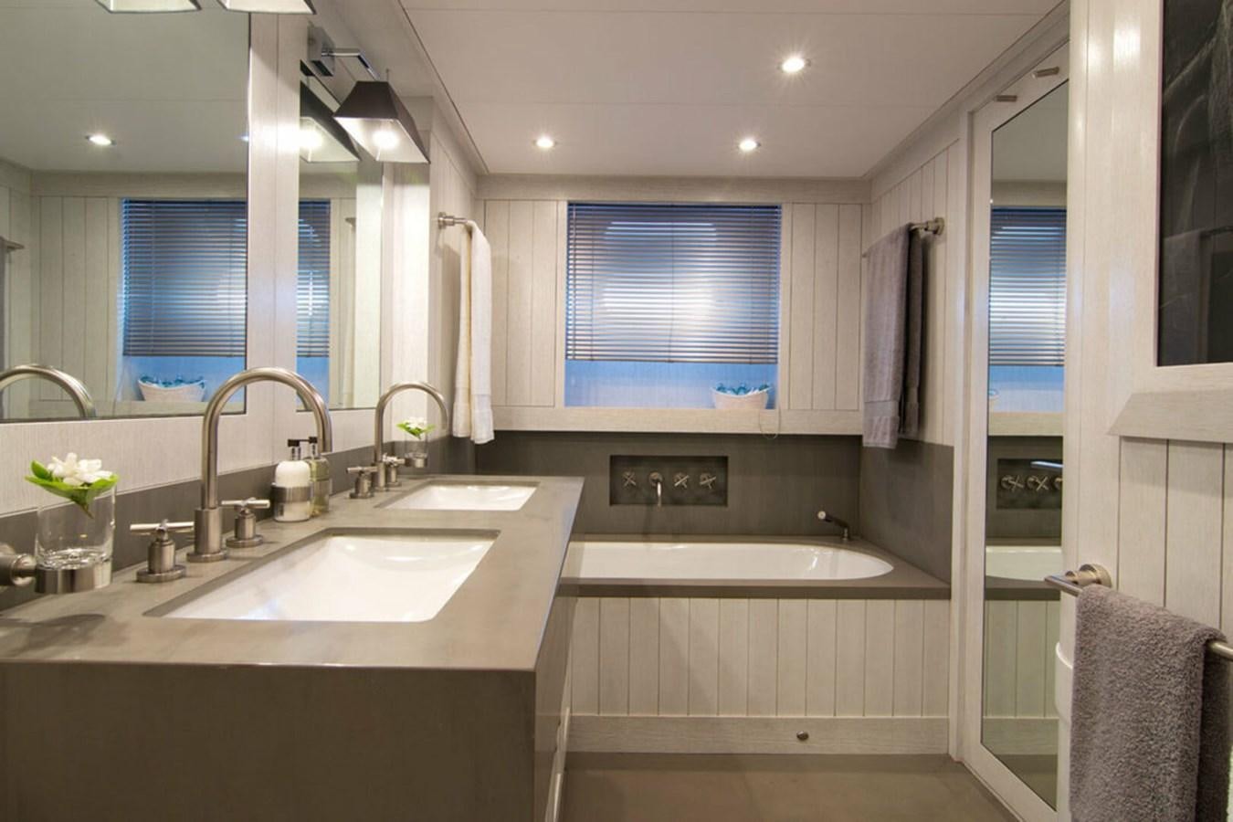 a bathroom with a sink and a mirror aboard REGINA K Yacht for Sale