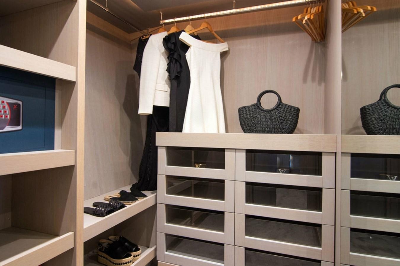 a shelf with clothes on it aboard REGINA K Yacht for Sale