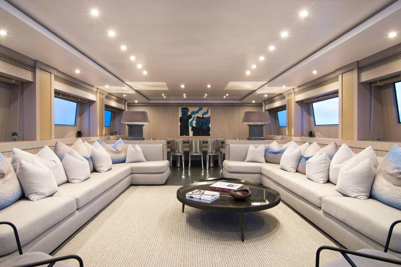 a living room with a couch and a table aboard REGINA K Yacht for Sale