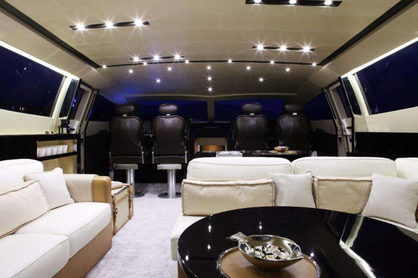 a room with a table and chairs aboard OTAM 80 Yacht for Sale