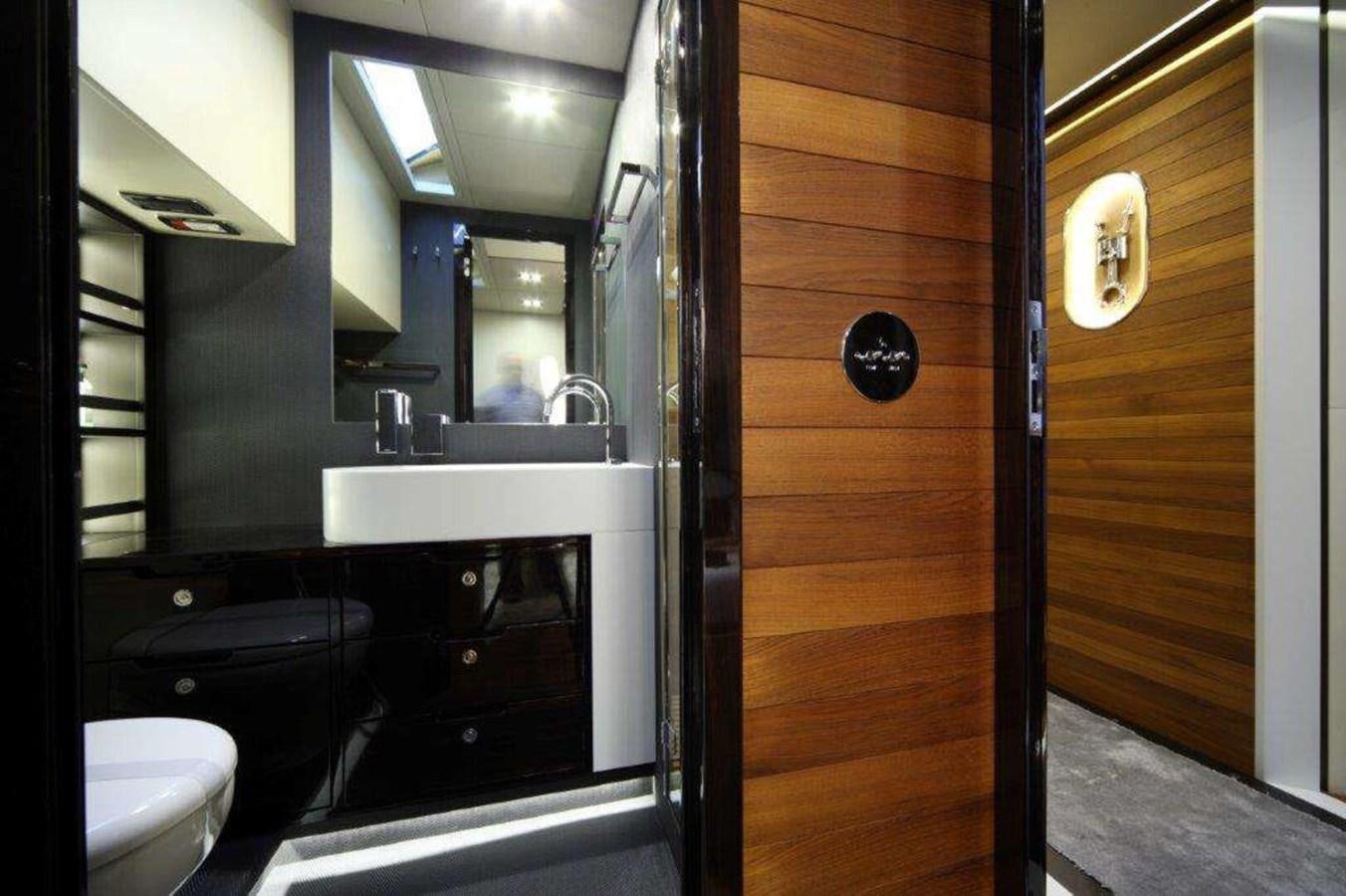 a bathroom with a sink and a mirror aboard OTAM 80 Yacht for Sale