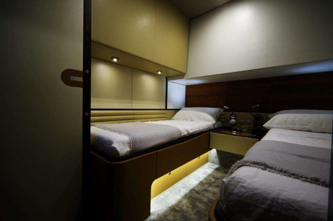 a room with two beds aboard OTAM 80 Yacht for Sale