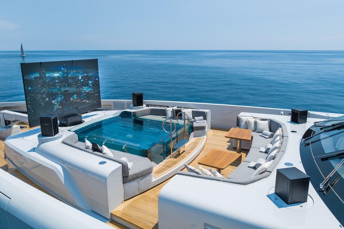 a large pool with a large screen aboard JIMMY Yacht for Sale