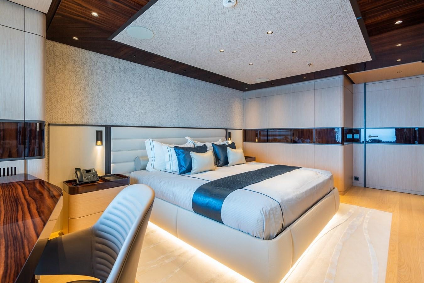 a room with a bed and a desk aboard JIMMY Yacht for Sale